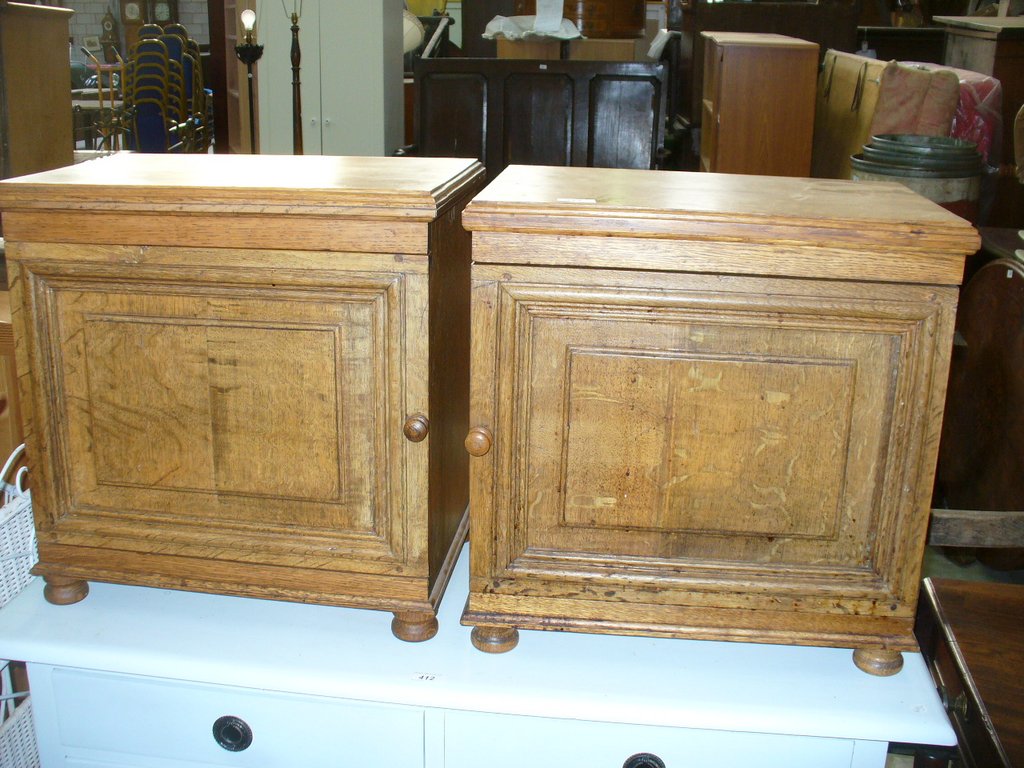 A Pair of modern oak bedside cabinets.