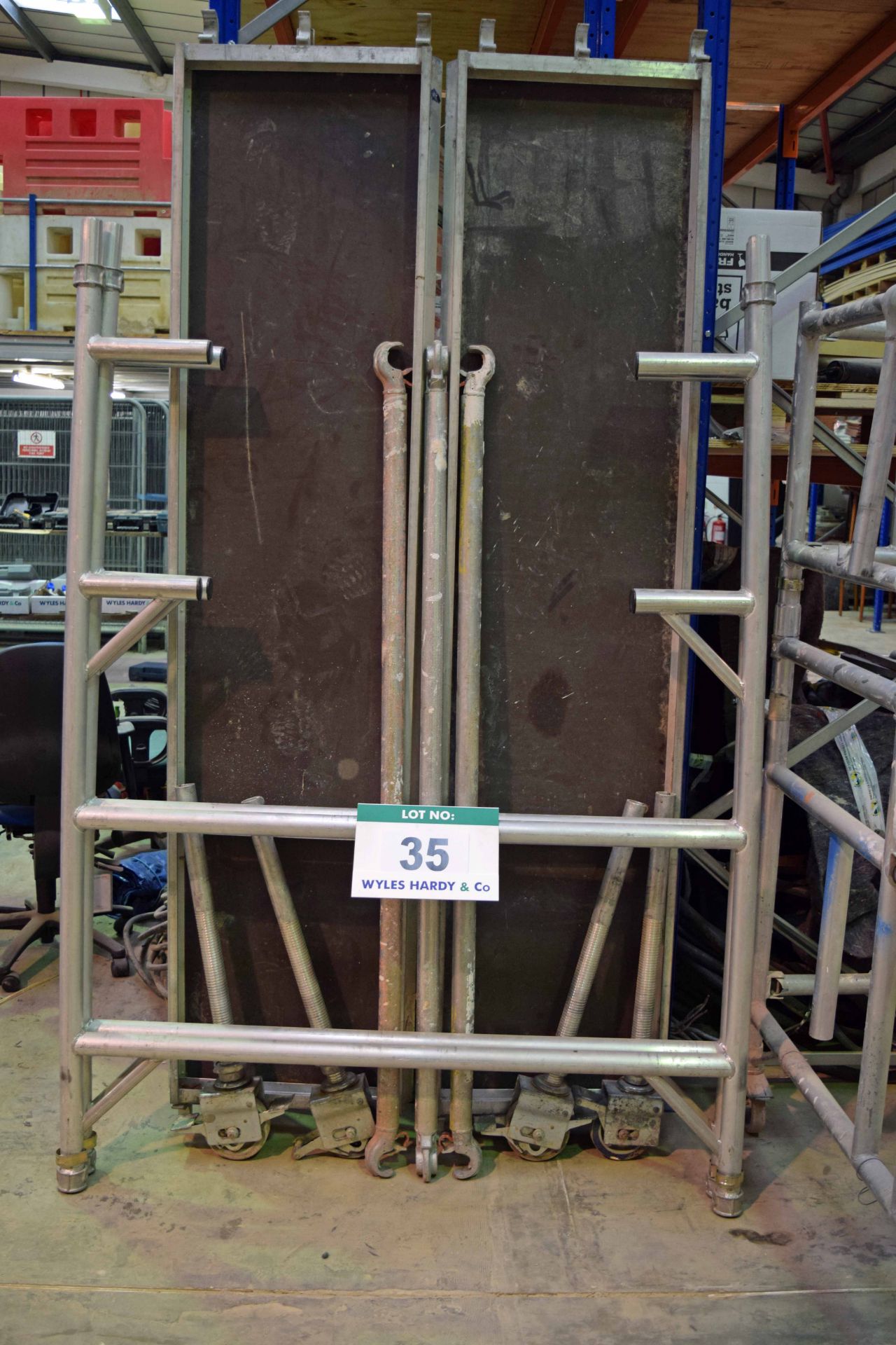 An Aluminium Single Lift Mobile Scaffold Tower Work Platform with Braces & YOUNGMAN Board