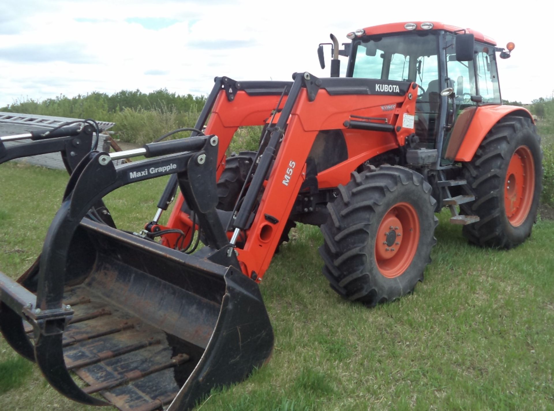 M135X Kubota MFWD Diesel Tractor, M55 Loader & Grapple, New Radial tires, 3 pth, shows 2290 hrs,