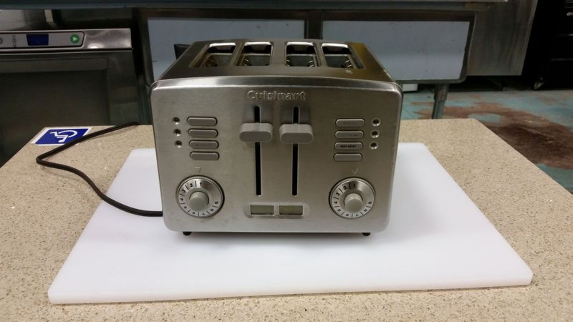 4 slice toaster, lot of cutlery & white cutting board