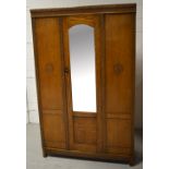 A 20th century oak single door wardrobe,