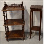 An early 20th century walnut whatnot with pierced gallery shelves inlaid to the top and sides and