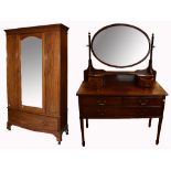 An Edwardian mahogany single mirror door wardrobe, with single lower drawer with brass handles,