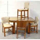 An Art Deco maple dining table with chamfered corners on twin slab supports,122 x 76 x 78cm (af) and