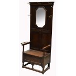 An oak box seat hall stand,