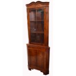 A reproduction corner display cabinet,