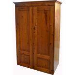 A modern two door pine wardrobe, width 110cm,