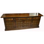 A 20th century oak sideboard of large proportions,