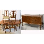 A reproduction walnut extending dining table on knee carved cabriole legs,