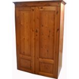 A modern two door pine wardrobe, width 110cm.