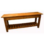 A pine dresser base, with two long drawers over lower slat shelf, 75 x 184cm.
