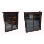 A late 19th/early 20th century mahogany freestanding bookcase with glazed doors enclosing three