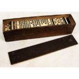 A cased set of twelve spot dominoes, with ebony and bone tiles. CONDITION REPORT: 55 tiles in