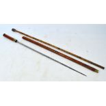 A late Victorian malacca shafted sword stick, length 83cm and a bamboo shafted walking cane