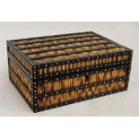 A late 19th century Anglo-Indian ebony and bone detailed porcupine quill box with hinged lid, with