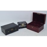 Two vintage leather jewellery boxes and a contemporary mother of pearl inlaid musical jewellery box