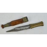 An interesting 19th century double edged dagger with brass strapwork grip,