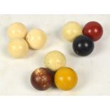 Three vintage ivory billiard balls and six simulated ivory examples (9).