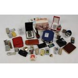 A collection of lighters including examples by Corona, Colton, etc, also a pipe, cigar cases,