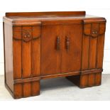 A 20th century oak two door sideboard with integral drawers for cutlery, width 122cm.