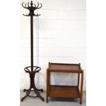 A freestanding oak coat hanger/umbrella stand and a retro oak two tier table formed from two twin