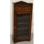 A 20th century slim oak bookcase with single upper drawer on bracket feet, width 62cm.