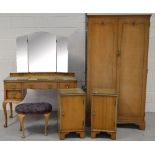 A 20th century walnut two door wardrobe with shell decoration to the top and raised on bracket feet,