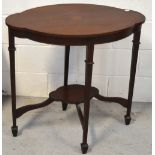 An Edwardian mahogany and inlaid two tier occasional table of oval form on tapering legs,