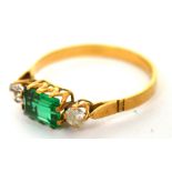 A yellow metal ring set with green rectangular stone and white stone either side, size L, approx 1.