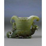 A Chinese carved jade libation cup with flared spout,