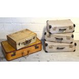 A set of three vintage graduating suitcases,