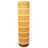 A 1970s retro  floor standing cylinder lamp with wooden base, height 81cm.