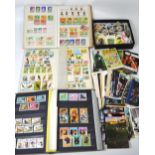 A quantity of British and World stamps to seven albums and loose,