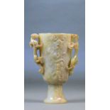 A Chinese carved jade and included twin handled cup with carved pierced chilong handles and