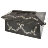 A large ebonised and mother of pearl inlaid two division tea caddy with central glass mixing bowl