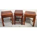 Two 20th century Oriental hardwood square side tables and one similar rectangular example,