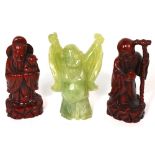 A jadeite laughing Buddha figurine and two Oriental figurines of a travelling gentleman and a man