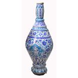A very large 19th century Isnik pottery vessel with blue/green floral decorated ground and four