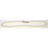 A single strand pearl necklace with 9ct yellow gold clasp, length 40cm.