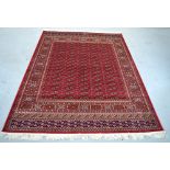 A red ground Bokhara style carpet, 230 x 160cm.