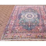 An antique Persian Tabriz rug, 182 x 139cm. CONDITION REPORT Very worn in places.