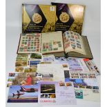 A quantity of British and world stamps and first day covers contained within two albums and loose