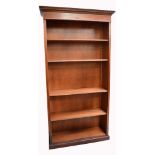 A contemporary mahogany satinwood cross banded open bookcase with moulded dentil cornice above