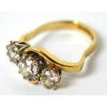 An 18ct gold ring with three graduating diamonds, approx 1.7g (af).