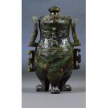 A Chinese russet included carved jade twin handled vase and cover of archaic form with high