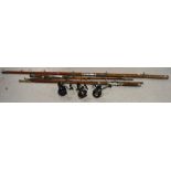 Three fishing rods to include a Mitchell Microlight  example and two others and three fishing reels,
