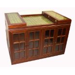 A 20th century Oriental hardwood sideboard with four glazed doors to the base,