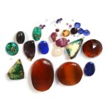 A quantity of uncut stones to include uncut rubies, lapis, turquoise,