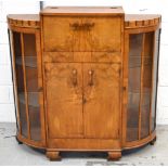 An Art Deco two door cocktail cabinet,