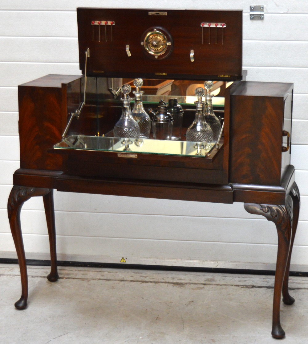 A 20th century flame mahogany cocktail cabinet with integral accessories for making cocktails to - Image 2 of 2